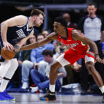 
              Dallas Mavericks guard Luka Doncic, left, looks for room against New Orleans Pelicans forward Herbert Jones, right, during the first half of an NBA basketball game, Thursday, Feb. 2, 2023, in Dallas. (AP Photo/Brandon Wade)
            