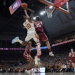 
              Texas guard Sir'Jabari Rice (10) drives to the basket against Oklahoma forward Tanner Groves (35) during the second half of an NCAA college basketball game in Austin, Texas, Saturday, Feb. 18, 2023. (AP Photo/Eric Gay)
            