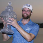 
              Chris Kirk holds the trophy after winning the Honda Classic golf tournament in a playoff against Eric Cole, Sunday, Feb. 26, 2023, in Palm Beach Gardens, Fla. (AP Photo/Lynne Sladky)
            