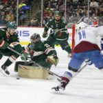 
              Minnesota Wild goaltender Marc-Andre Fleury (29) and center Sam Steel (13) stops a shot by Colorado Avalanche center Andrew Cogliano (11) as Wild left wing Jordan Greenway (18) watches during the second period of an NHL hockey game Wednesday, Feb. 15, 2023, in St. Paul, Minn. (AP Photo/Andy Clayton-King)
            