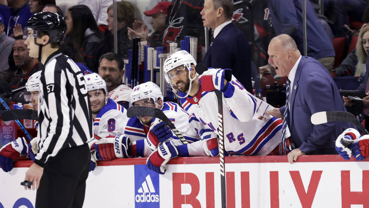 New York Rangers coach Gerard Gallant, right, and center Vincent Trocheck, next to Gallant, argue a...