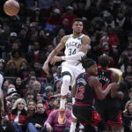 
              Milwaukee Bucks' Giannis Antetokounmpo (34) passes the ball during the first half of an NBA basketball game against the Chicago Bulls, Thursday, Feb. 16, 2023, in Chicago. (AP Photo/Charles Rex Arbogast)
            