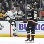 
              Los Angeles Kings center Anze Kopitar, left, celebrates his goal as Arizona Coyotes defenseman J.J. Moser skates by during the first period of an NHL hockey game Saturday, Feb. 18, 2023, in Los Angeles. (AP Photo/Mark J. Terrill)
            