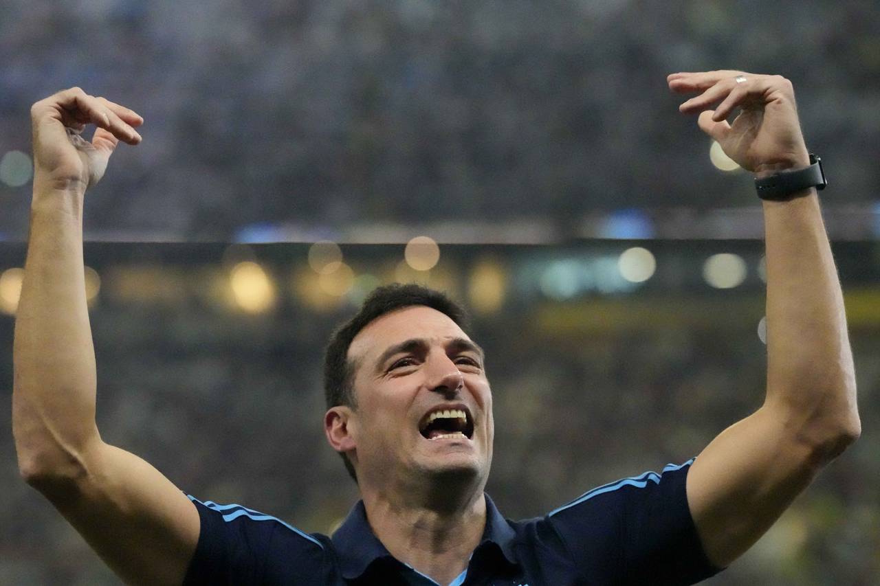 FILE - Argentina's head coach Lionel Scaloni celebrates his team's win after the World Cup final so...