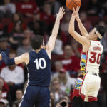 
              Nebraska's Keisei Tominaga (30) shoots a 3-point basket against Penn State's Andrew Funk (10) during the second half of an NCAA college basketball game Sunday, Feb. 5, 2023, in Lincoln, Neb. (AP Photo/Rebecca S. Gratz)
            