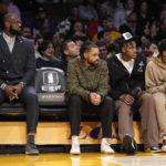 
              Los Angeles Lakers' LeBron James, left, sits on the bench with D'Angelo Russell, second from left, Jarred Vanderbilt, second from right, and Malik Beasley during the second half of an NBA basketball game against the Milwaukee Bucks Thursday, Feb. 9, 2023, in Los Angeles. (AP Photo/Mark J. Terrill)
            