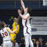 
              Saint Mary's center Mitchell Saxen (11) blocks a shot by San Francisco guard Khalil Shabazz (0) during the second half of an NCAA college basketball game, Thursday, Feb. 2, 2023, in Moraga, Calif. (AP Photo/D. Ross Cameron)
            