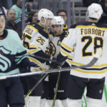 
              Boston Bruins center Patrice Bergeron celebrates his goal against the Seattle Kraken with defenseman Brandon Carlo (25) during the second period of an NHL hockey game Thursday, Feb. 23, 2023, in Seattle. (AP Photo/John Froschauer)
            