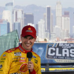 
              NASCAR Cup Series driver Joey Logano (22) speaks to reporters ahead of practice sessions before a NASCAR exhibition auto race at Los Angeles Memorial Coliseum, Saturday, Feb. 4, 2023, in Los Angeles. (AP Photo/Ashley Landis)
            