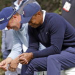 
              Tiger Woods, right, jokes with Justin Thomas as they wait to tee off on the fourth hole during the first round of the Genesis Invitational golf tournament at Riviera Country Club, Thursday, Feb. 16, 2023, in the Pacific Palisades area of Los Angeles. (AP Photo/Ryan Kang)
            