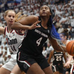 
              South Carolina's Aliyah Boston (4) drives to the basket as UConn's Dorka Juhasz (14) defends in the second half of an NCAA college basketball game, Sunday, Feb. 5, 2023, in Hartford, Conn. (AP Photo/Jessica Hill)
            