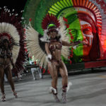 
              Performers from the Imperio Serrano samba school take part in during Carnival celebrations at the Sambadrome in Rio de Janeiro on Sunday, Feb. 19, 2023. (AP Photo/Silvia Izquierdo)
            