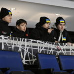 
              FILE -  Ukrainian peewee hockey players check out the arena as they arrive, Wednesday, Feb. 1, 2023 at the Videotron Centre in Quebec City. The Ukraine team will compete at the Quebec international peewee hockey tournament. (Jacques Boissinot/The Canadian Press via AP, File)
            