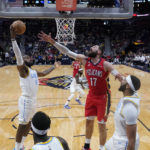 
              Los Angeles Lakers forward LeBron James (6) pulls down a rebound against New Orleans Pelicans center Jonas Valanciunas (17) in the first half of an NBA basketball game in New Orleans, Saturday, Feb. 4, 2023. (AP Photo/Gerald Herbert)
            