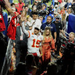 
              Kansas City Chiefs quarterback Patrick Mahomes (15) leaves the field with his wife, Brittany Mahomes, after the NFL Super Bowl 57 football game against the Philadelphia Eagles, Sunday, Feb. 12, 2023, in Glendale, Ariz. The Kansas City Chiefs defeated the Philadelphia Eagles 38-35. (AP Photo/David J. Phillip)
            