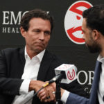 
              Newly hired Atlanta Hawks NBA basketball coach Quin Snyder, left, shakes hands with general manager Landry Fields during a news conference Monday, Feb. 27, 2023, in Atlanta. AP Photo/John Bazemore)
            