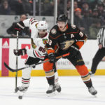 
              Anaheim Ducks' Jakob Silfverberg (33) moves the puck against Chicago Blackhawks' Andreas Athanasiou (89) during the first period of an NHL hockey game Monday, Feb. 27, 2023, in Anaheim, Calif. (AP Photo/Jae C. Hong)
            