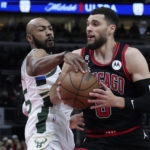 
              Chicago Bulls' Zach LaVine drives to the basket under pressure from Milwaukee Bucks' Jevon Carter during the first half of an NBA basketball game Thursday, Feb. 16, 2023, in Chicago. (AP Photo/Charles Rex Arbogast)
            