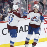 
              Colorado Avalanche's J.T. Compher (37) and Matt Nieto (83) celebrate Nieto's goal against the Winnipeg Jets during the second period of an NHL hockey game in Winnipeg, Manitoba, Friday, Feb. 24, 2023. (John Woods/The Canadian Press via AP)
            