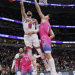 
              Chicago Bulls guard Zach LaVine (8) shoots over Washington Wizards forward Deni Avdija (9) during the first half of an NBA basketball game in Chicago, Sunday, Feb. 26, 2023. (AP Photo/Nam Y. Huh)
            