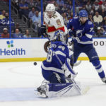 
              Florida Panthers' Matthew Tkachuk (19) interferes with Tampa Bay Lightning goaltender Andrei Vasilevskiy as Victor Hedman (77) defends during the first period of an NHL hockey game Tuesday, Feb. 28, 2023, in Tampa, Fla. After review the goal was disallowed due to interference. (AP Photo/Mike Carlson)
            