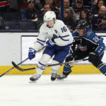 
              Toronto Maple Leafs forward Mitchell Marner, left, controls the puck in front of Columbus Blue Jackets forward Patrik Laine during the first period of an NHL hockey game in Columbus, Ohio, Friday, Feb. 10, 2023. (AP Photo/Paul Vernon)
            