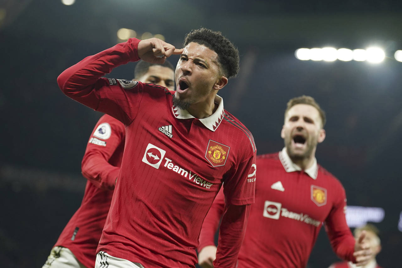 Manchester United's Jadon Sancho celebrates after scoring his sides second goal during the English ...