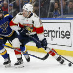 
              Florida Panthers' Matthew Tkachuk (19) controls the puck against St. Louis Blues' Nick Leddy during the first period of an NHL hockey game, Tuesday, Feb. 14, 2023, in St. Louis. (AP Photo/Scott Kane)
            