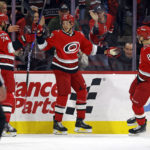 
              Carolina Hurricanes' Jesperi Kotkaniemi (82) celebrates after his goal with teammates Jaccob Slavin (74) and Martin Necas (88) during the first period of an NHL hockey game against the Montreal Canadiens in Raleigh, N.C., Thursday, Feb. 16, 2023. (AP Photo/Karl B DeBlaker)
            