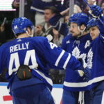 
              Toronto Maple Leafs' William Nylander (88) celebrates after his overtime goal against the Minnesota Wild with Auston Matthews (34) and Morgan Rielly (44) during NHL hockey game action in Toronto, Friday, Feb. 24, 2023. (Frank Gunn/The Canadian Press via AP)
            