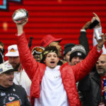 
              Kansas City Chiefs quarterback Patrick Mahomes and teammates react to the crowd during the Chiefs' victory celebration and parade in Kansas City, Mo., Wednesday, Feb. 15, 2023. The Chiefs defeated the Philadelphia Eagles Sunday in the NFL Super Bowl 57 football game. (AP Photo/Reed Hoffmann)
            