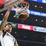 
              Dallas Mavericks guard Josh Green dunks during the first half of an NBA basketball game against the Los Angeles Clippers Wednesday, Feb. 8, 2023, in Los Angeles. (AP Photo/Mark J. Terrill)
            