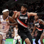 
              Oklahoma City Thunder guard Shai Gilgeous-Alexander, left, drives to the basket on Portland Trail Blazers forward Trendon Watford (2) during the first half of an NBA basketball game in Portland, Ore., Friday, Feb. 10, 2023. (AP Photo/Steve Dykes)
            