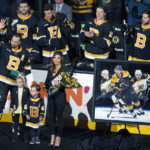 
              Boston Bruins' David Krejci (46) waves as he stands with his family during a ceremony to honor his 1000th game with the team before an NHL hockey game against the Ottawa Senators, Monday, Feb. 20, 2023, in Boston. (AP Photo/Michael Dwyer)
            