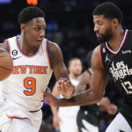 
              New York Knicks guard RJ Barrett (9) drives against Los Angeles Clippers guard Paul George (13) in the first half of an NBA basketball game, Saturday, Feb. 4, 2023, at Madison Square Garden in New York. (AP Photo/Mary Altaffer)
            