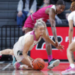 
              Michigan State's Tory Ozment, left, and Maryland's Diamond Miller vie for the ball during the second half of an NCAA college basketball game, Saturday, Feb. 18, 2023, in East Lansing, Mich. (AP Photo/Al Goldis)
            
