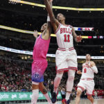 
              Chicago Bulls forward DeMar DeRozan (11) drives to the basket against Washington Wizards forward Kyle Kuzma, left, during the first half of an NBA basketball game in Chicago, Sunday, Feb. 26, 2023. (AP Photo/Nam Y. Huh)
            