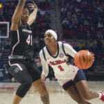 
              Mississippi guard Myah Taylor (1) attempts to dribble past the defense of South Carolina guard Kierra Fletcher (41) during the second half of an NCAA college basketball game in Oxford, Miss., Sunday, Feb. 19, 2023. (AP Photo/Rogelio V. Solis)
            