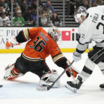 
              Anaheim Ducks goaltender John Gibson, left, is scored on by Los Angeles Kings right wing Adrian Kempe as left wing Kevin Fiala watches during the second period of an NHL hockey game Friday, Feb. 17, 2023, in Anaheim, Calif. (AP Photo/Mark J. Terrill)
            