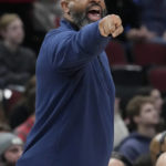 
              Washington Wizards head coach Wes Unseld Jr. points as he calls his team during the first half of an NBA basketball game against the Chicago Bulls in Chicago, Sunday, Feb. 26, 2023. (AP Photo/Nam Y. Huh)
            