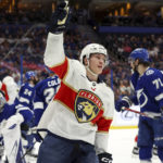 
              Florida Panthers' Anton Lundell celebrates his goal against the Tampa Bay Lightning during the first period of an NHL hockey game Tuesday, Feb. 28, 2023, in Tampa, Fla. (AP Photo/Mike Carlson)
            