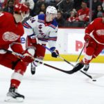 
              New York Rangers right wing Kaapo Kakko (24) brings the puck up the ice against Detroit Red Wings left wing Dominik Kubalik, left, and center Robby Fabbri, right, during the first period of an NHL hockey game Thursday, Feb. 23, 2023, in Detroit. (AP Photo/Duane Burleson)
            