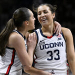 
              UConn's Nika Muhl, left, congratulates Caroline Ducharme (33), who made the go-ahead basket in the final seconds of the team's NCAA college basketball game against Creighton, Wednesday, Feb. 15, 2023, in Storrs, Conn. (AP Photo/Jessica Hill)
            