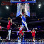 
              Philadelphia 76ers' Tobias Harris dunks the ball as the Houston Rockets look on during the first half of an NBA basketball game, Monday, Feb. 13, 2023, in Philadelphia. (AP Photo/Chris Szagola)
            