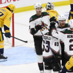 
              Arizona Coyotes left wing Lawson Crouse (67) celebrates with teammates after his goal during the third period of an NHL hockey game against the Nashville Predators, Monday, Feb. 13, 2023, in Nashville, Tenn. (AP Photo/Mark Zaleski)
            