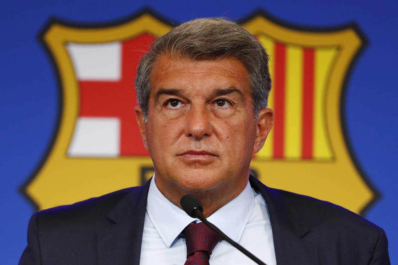 FILE - FC Barcelona club President Joan Laporta pauses during a news conference in Barcelona, Spain...