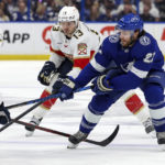 
              Tampa Bay Lightning center Brayden Point is checked by Florida Panthers' Sam Reinhart (13) during the second period of an NHL hockey game Tuesday, Feb. 28, 2023, in Tampa, Fla. (AP Photo/Mike Carlson)
            