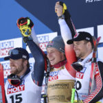 
              Switzerland's Marco Odermatt, center, winner of the alpine ski, men's World Championship downhill, poses on podium with second placed Norway's Aleksander Aamodt Kilde, left, and third placed Canada's Cameron Alexander in Courchevel, France, Sunday, Feb. 12, 2023. (AP Photo/Alessandro Trovati)
            
