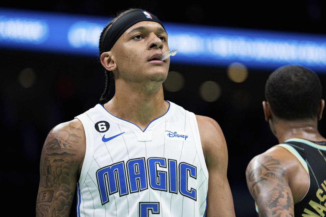 Orlando Magic forward Paolo Banchero looks on during the first half of an NBA basketball game again...