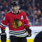 
              FILE - Chicago Blackhawks' Patrick Kane smiles during an NHL hockey game Jan. 19, 2023, in Philadelphia. The New York Rangers have acquired Kane in a trade with the Blackhawks. The Rangers sent a conditional second-round pick and a future fourth-rounder to Chicago and a third-rounder in 2025 to Arizona to complete the deal. Kane joins the Rangers after waiving his no-movement clause to leave the only NHL organization he has known. (AP Photo/Matt Slocum, File)
            